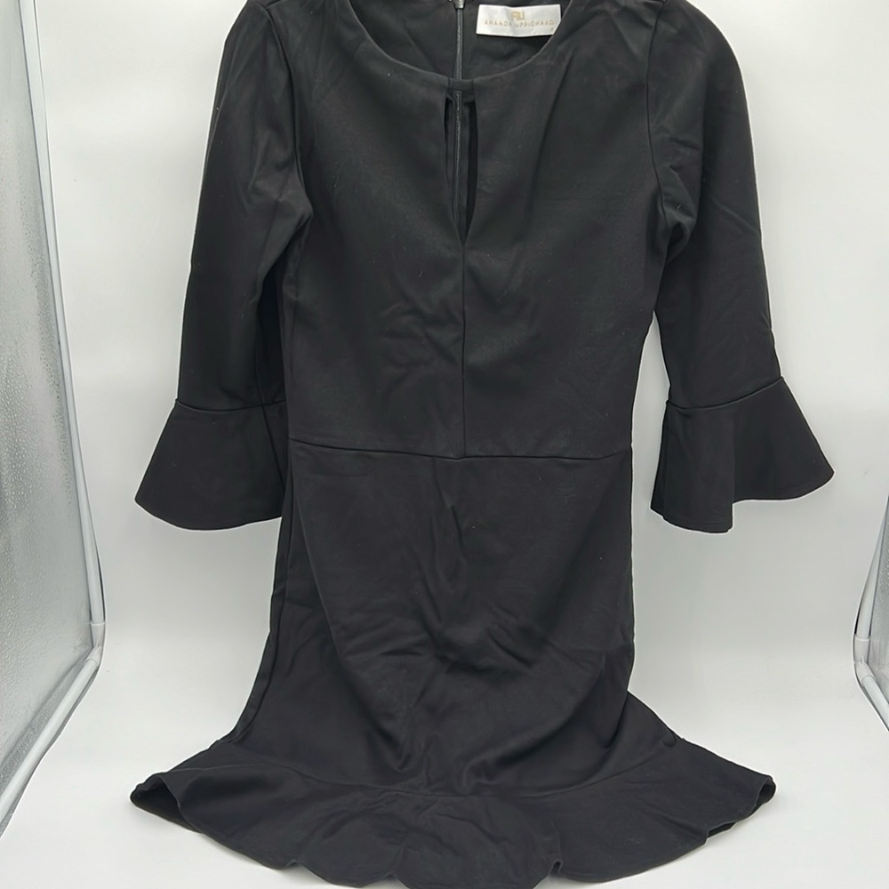 Amanda UpRichard black dress ladies size small. Bell sleeves flared bottom.